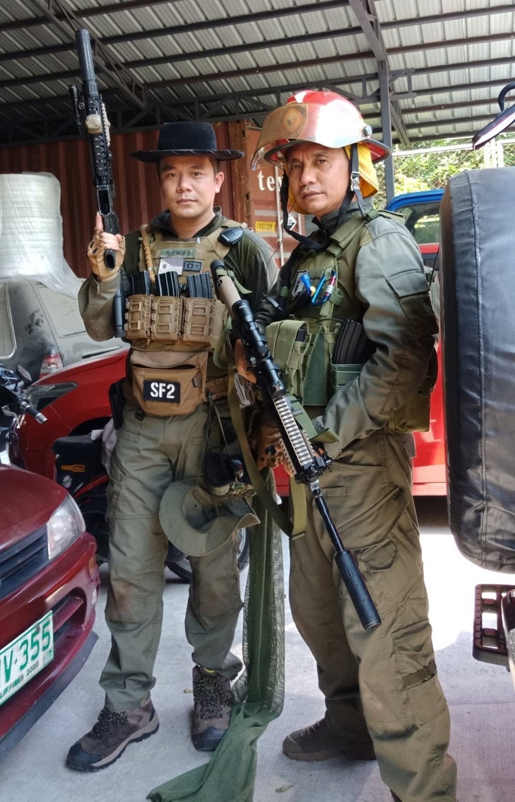 Two members suit up in the staging area before a game.